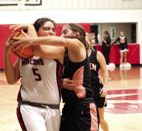 Macomb freshman Desirae Burleson fights to keep possession of the ball as a Paden player tries to steal it during the fourth quarter of the game on Nov. 4. Macomb lost, 30-49. Countywide &amp;amp; Sun/Natasha Dunagan