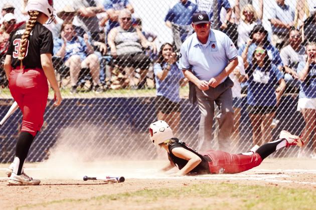 North Rock Creek’s Katie Larson slides safely home in the first round of the state games. The Lady Cougars beat Dickson 19-0.