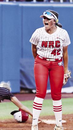 North Rock Creek’s Sarah Campbell fired up after making the third out at third base.