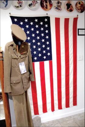 In the Meeting Room of the Tecumseh Historical Society and Museum, there is a 49-star U.S. Flag, the uniform of Claude Willis who was stationed in Pearl Harbor, and a large collection of Norman Rockwell plates which belonged to Board President Jane Fleming. Countywide &amp; Sun/Natasha Dunagan