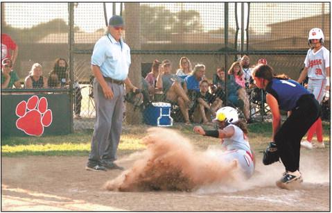 Maud’s Amerikus Street slides into home after stealing second and third, as the Bowlegs pitcher throws the ball to tag her too late. Maud won the home game on Aug. 25, 11-0. Countywide &amp; Sun/Natasha Dunagan