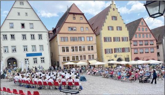 The Oklahoma Ambassadors of Music, including two band students from Bethel High School, perform in Germany in June. Photo provided.