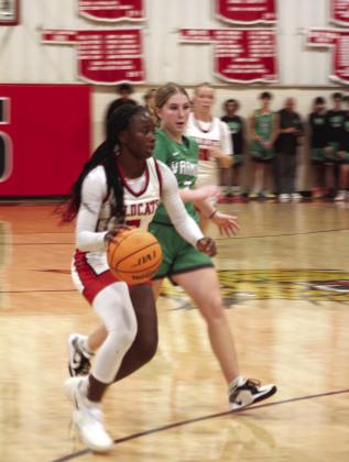 Earlsboro's Zeaonna McGregor takes the ball upcourt during the fourth quarter of the Nov. 7 home game against Varnum. The Lady Wildcats lost 39-50.