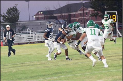 Shawnee Quarterback, junior Jamir Owens, gets wrapped up in a tackle by the Seminole Chieftains.. Countywide &amp; Sun/Julie Talton
