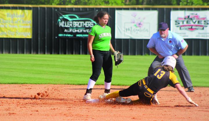 Tecumseh sophomore Josie Walker slides into second base after hitting a double in the Class 5A District Tournament against Seminole on April 24. The Lady Savages won both games, 12-0 and 19-0.