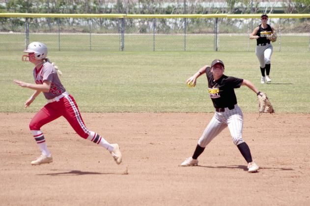 Tecumseh senior Bristin Hayes throws to first in the second inning of the Class 5A Slow Pitch State Quarterfinals on May 2.