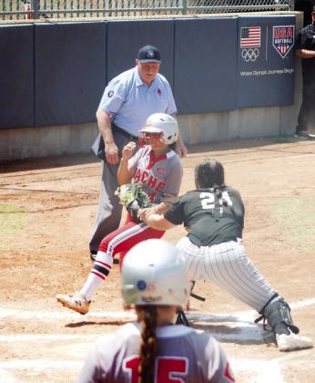 Tecumseh catcher Aubre Peacock tags a Cache runner out at home in the second inning of the State Quarterfinals.