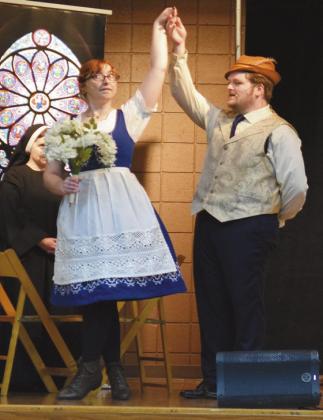 Left: Wall gives the audience a spin while acting out her marriage to the Captian (played by Jordan Apple) as a Nun (Kristin Kuns) looks on. The show performed a few of the hit songs, explained the history and factual information behind the classic tale and allowed audience members to participate in the performance and ask questions at the end.