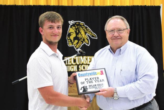 Sports writer Danny Chambers, right, presents the Countywide &amp;amp; Sun Player of the Year Award to senior Dylan Graham. He also received the Outstanding Male Athlete of the Year Award.