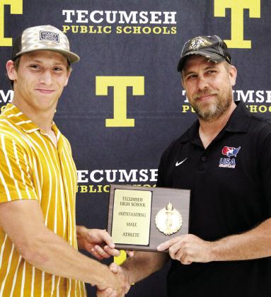 Tecumseh Head Wrestling Coach Billy Don Sigman, right, presents the Outstanding Male Athlete Award to Jace Frazier during the THS Athletic Awards on May 15. Sigman said Frazier is a three-time state qualifier in wrestling and conference champion. Countywide &amp; Sun/Natasha Dunagan