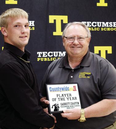 Sports Reporter Danny Chambers, right, presents the Countywide &amp; Sun Player of the Year Award to football player Garrett Chaffin during the THS Athletic Awards on May 15. Chambers said he chose Chaffin for his "consistency" in the sport. Countywide &amp; Sun/Natasha Dunagan