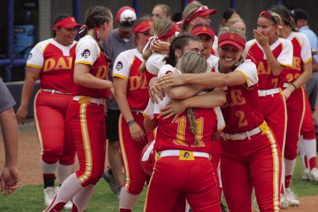 Three of the Dale Lady Pirates celebrate their Class 4A State Semifinals victory over Latta with a group hug on April 30.