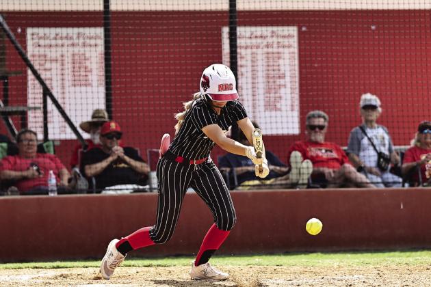 North Rock Creek’s Aubree Shivelhood lays down a bunt in action Friday. Photo courtesy of Gowin Photography