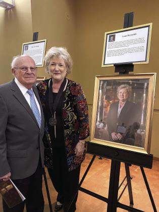 Melvin Moran (left) congratulates Lana Reynolds (right) as they stand next to her portrait. Portraits of each honoree were unveiled at the reception and will remain on display at the Oklahoma History Center until being moved to the Oklahoma State Capitol in January. The exhibit will then travel to several locations around the State. A complete listing of the award recipients is available at: www/55over55.com/winners. Photo provided