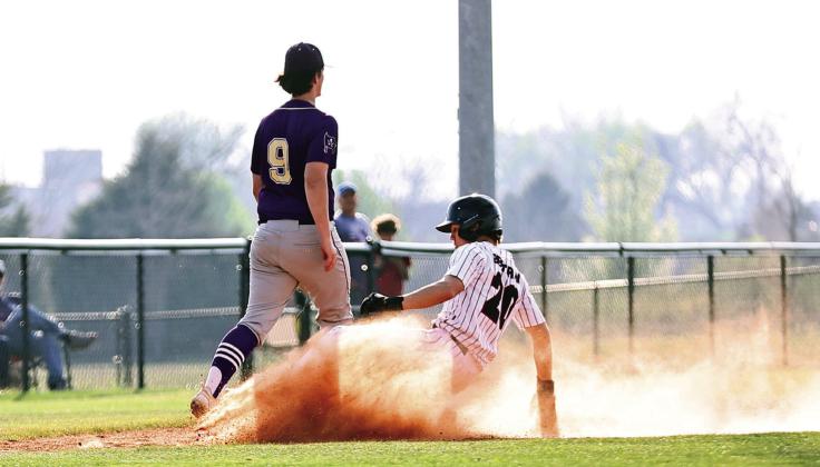North Rock Creek's Hunter Bertram slides safely into third base. The NRC baseball team beat Mannford, 8-3, in a district game Tuesday, Mar. 25, 2025. Photo courtesy of Gowin Photography