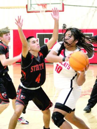 Earlsboro’s Elias Barrazza looks to pass during the second half of their Homecoming game against Strother on Dec. 16. Barrazza made five points in the game. The Wildcats won, 67-43. Countywide &amp;amp; Sun/ Natasha Dunagan