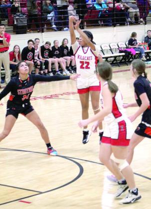Earlsboro’s Chelsea Deere tries for a three-pointer in the first quarter of the Homecoming game against Strother on Dec. 16. The Lady Wildcats lost 43-62.