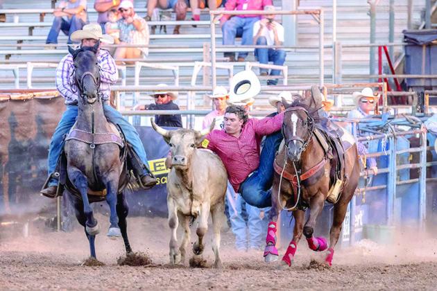 Dally Trussell, of McLoud, participates in the steer wrestling on the night of July 10 and completes his run in 5.3 seconds at the International Finals Youth Rodeo. Photo courtesy of Richelle Treece.