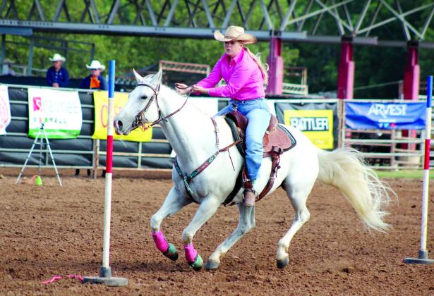 Josey Milburn, of Asher, weaves through the poles on the morning of July 11 at the International Finals Youth Rodeo. Countywide &amp; Sun/Natasha Dunagan