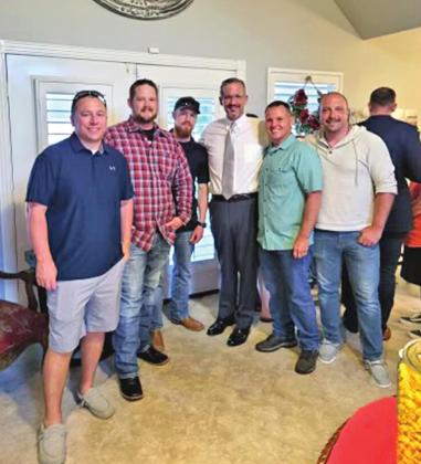 Pottawatomie and Lincoln county’s newly elected District Attorney David Hammer celebrates the win with local law enforcement officers during the watch party Tuesday evening. Photo provided