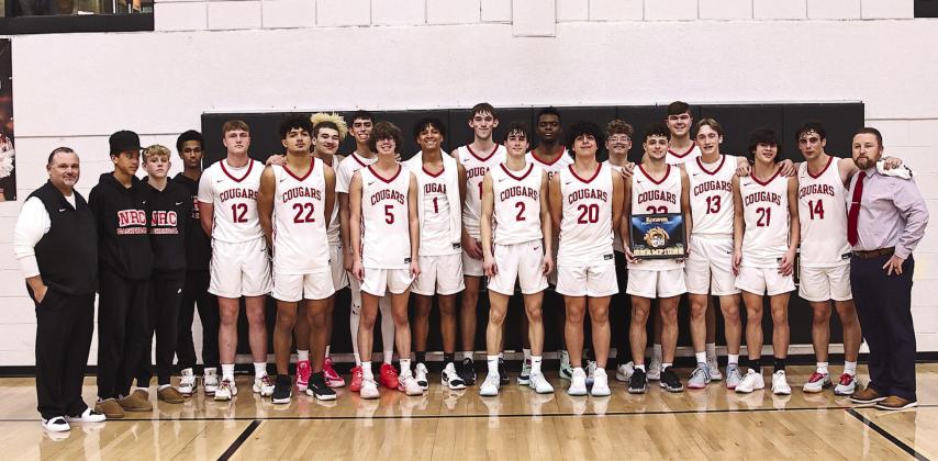 North Rock Creek Cougars pose with their championship trophy.
