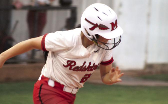 McLoud's Miley Hicklin runs to second base after hitting a double during the Aug. 24 home game against Earlsboro.