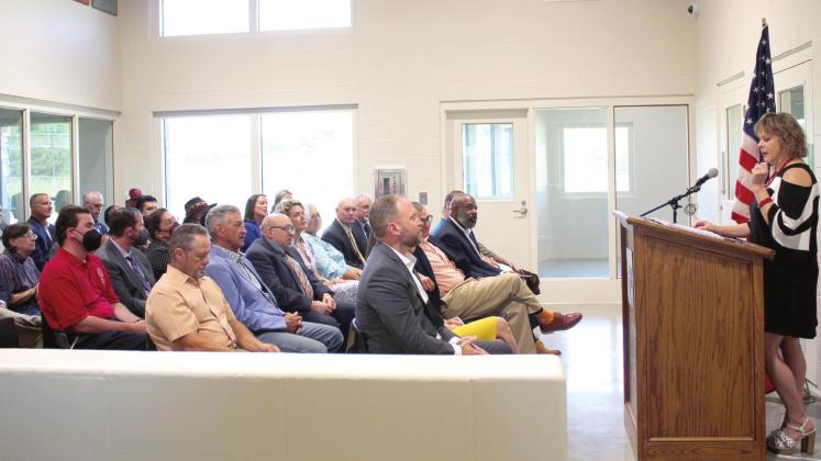 OJA Board Chair Karen Youngblood speaks during the ribbon-cutting ceremony for the Next Generation Campus on June 24. The ceremony was held inside the Sycamore cottage, one of seven cottages that were built at COJC in Tecumseh. Countywide &amp;amp; Sun/Natasha Dunagan