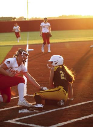 Tecumseh freshman Macie Dukes is tagged out by Dale pitcher Salem Flatt, as Dukes tries to slide home, to end the Aug. 18 game at Dale in the fourth inning.