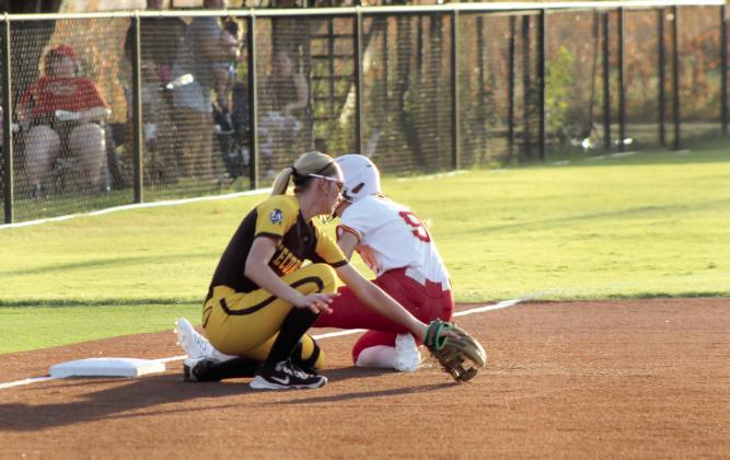 Dale senior Khloe Jones slides into third base after hitting a triple, as Tecumseh freshman Paisley Crosson tries for the tag.