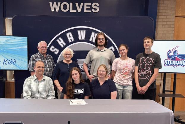Tenielle Kidd signed with Sterling College in Kansas to continue her swim career. Pictured with Tenielle for signing are parents Susan and Joe Kidd, siblings, Theron, Avelin, and Carson Kidd, and grandparents Barb and Brian Ellis.
