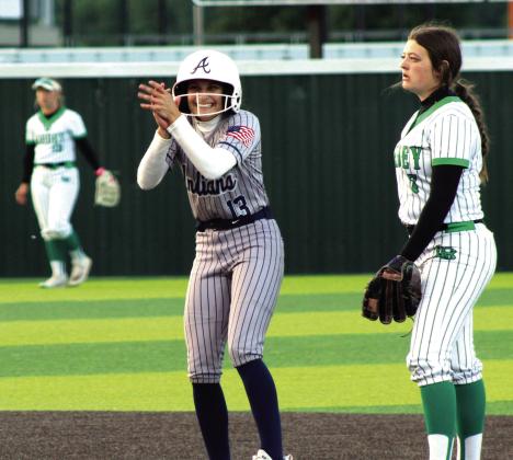 Asher freshman Amaya McFerran claps after hitting a double during the fifth inning of the Class B Slow Pitch State Championship game against Leedey, held at FireLake Ball Fields on May 6.