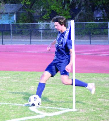 Shawnee’s Gage Karner makes a corner kick.