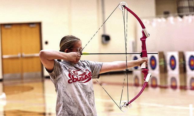 NRC Freshman Kimmy Bjorkley takes aim at the annual Veterans Weekend Shootout hosted at North Rock Creek Nov. 7-8. NRC High School and Middle School teams took first and the Elemenrary took second place. They are headed to Meeker's Annual Turkey Tournament, Nov. 14-15. Photo Courtesy of Gowin Photography