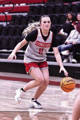 North Rock Creek’s Aubree Shivelhood brings the ball up court.