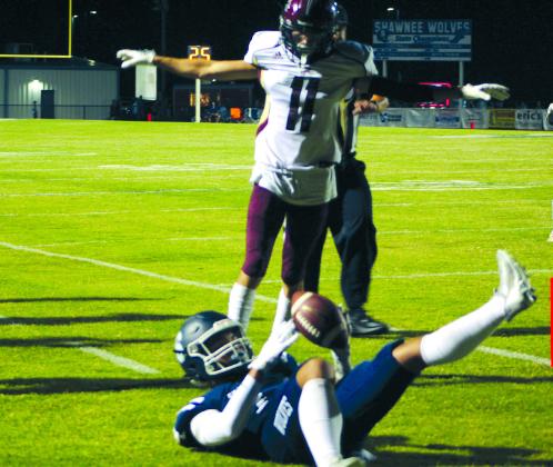 Shawnee senior Jaylon Wicks catches a pass near the end zone and rolls with it during the home game against Blanchard on Sept. 16.