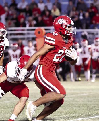 North Rock Creek's Caleb Hawkins rushes past the defense on his way to his first touchdown of the evening in a 2024 NRC regular season game. Photo courtesy of Gowin Photography