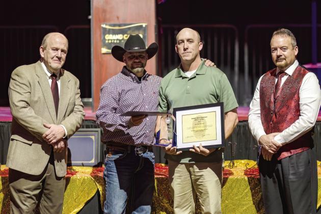 Cpl. Tom Williams (third from left) is awarded the 2022 Officer of the Year during the Shawnee Police Foundation Awards Banquest held at The Grand Casino Friday, Jan. 26. Pictured with Williams, from left, Shawnee Police Foundation Chairman Ken Stafford, 2021 Officer of the Year recipient Sgt. Russell Conner, and Shawnee Police Chief Mason Wilson. Photo by Workingman Photo.