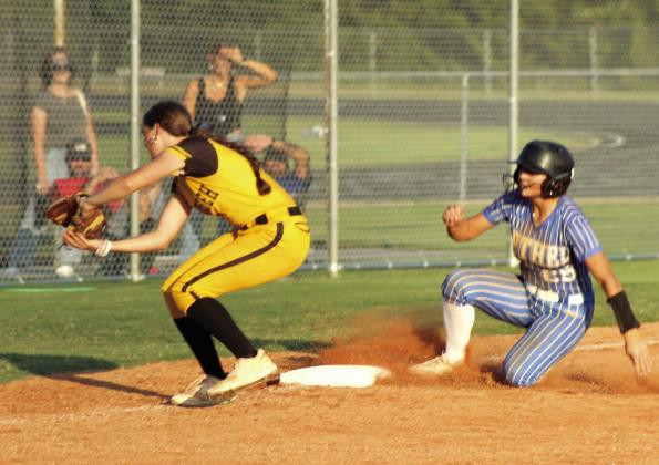 Tecumseh junior Madison Gray makes the catch at third, as Bethel junior Bailey Tucker slides into base, during the game at Tecumseh on Sept. 23. The Lady Wildcats won, 9-3. Natasha Dunagan, Countywide &amp;amp; Sun