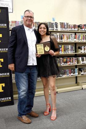 Serenity Jacoway accepts the Female Athlete of the Year Award from Fast Pitch Head Coach Chad Trahan. Photo provided by Kenetta Lisenbee.