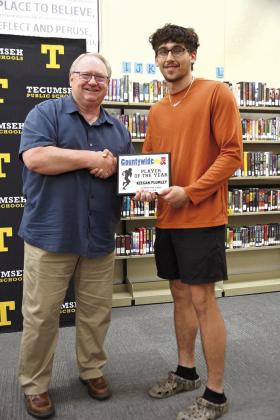 Sports reporter Danny Chambers presents the Countywide &amp;amp; Sun Player of the Year Award to Keegan Plumley.