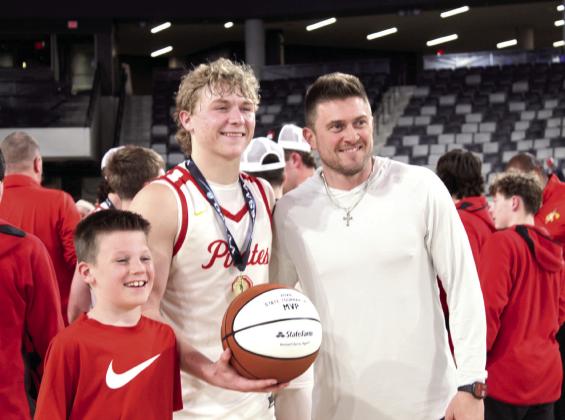 Dale senior Denton Forsythe receives the 2026 State Tournament MVP game ball from Rotnei Clarke, a State Farm Insurance Agent and former Verdigris High School and University of Arkansas basketball player, following the 2A State Championship victory at the OG&amp;amp;E Coliseum in OKC on March 14. Natasha Dunagan, Countywide &amp;amp; Sun