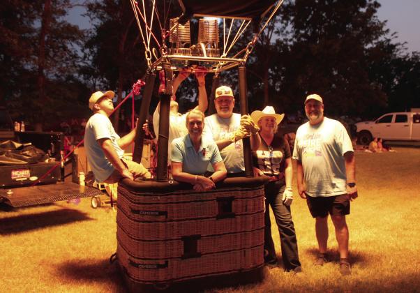 Tiffany and Bill Kinser, of Guthrie, and their balloon team made up of family members and employees from Sovereign Bank and KGFF, pause for a photo.