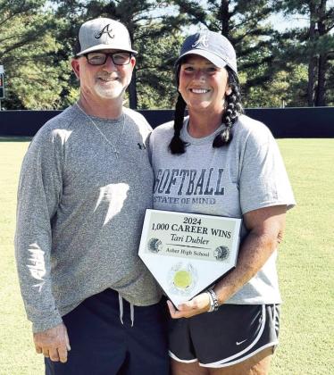 Asher Softball Coach, Tari Dubler clocked her 1,000 career win during district play. Also pictured is Tari’s husband and assistant coach, Scott Dubler. The Indians advance to Regional Play in Soper. Photo provided.