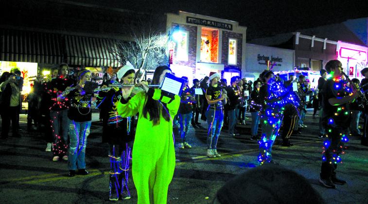 The Savage Pride Marching Band performs in front of Tecumseh City Hall for five judges in the Grinchmas Holiday Parade and Marching Band Contest on Dec. 8. Tecumseh’s band won first place, but will be ineligible for voting next year. They received $1,000 and a trophy from the City of Tecumseh. Douglass High School won second, and Cushing High School won third. Countywide &amp;amp; Sun/Natasha Dunagan