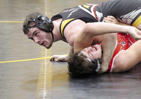 Tecumseh senior J.D. Sigman pins his Davis opponent and watches for the referee’s decision in the 165-pound class during the THS Wrestling Senior Night, Jan. 18. Countywide &amp; Sun/Natasha Dunagan