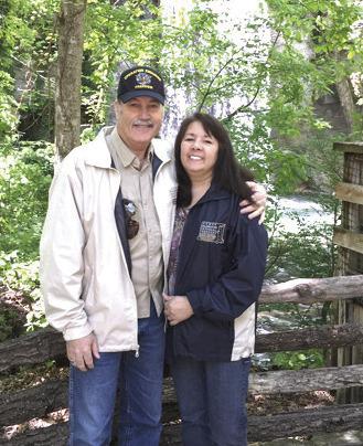Former Sheriff Mike Booth poses with his wife, Karen, at Silver Dollar City in Missouri. In retirement, Booth plans to spend more time traveling with Karen. Photo provided.
