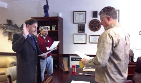 Then-Sheriff Mike Booth is sworn in, along with the late former deputy and friend Danny Columbus, as Special Deputy U.S. Marshals in past years. Photo provided