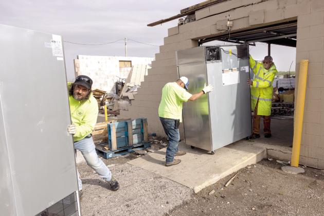 CPN staff work to clear out the CPN Distribution Center following the destruction. Photo provided