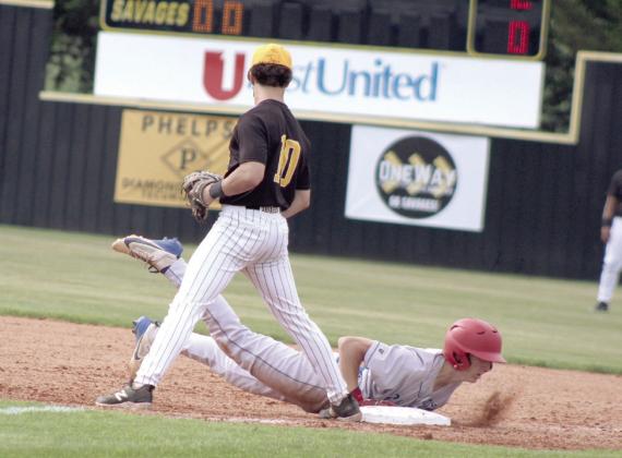Tecumseh senior Caleb Sparks watches a Chandler runner dive back to first base in the third inning. Natasha Dunagan, Countywide &amp;amp; Sun
