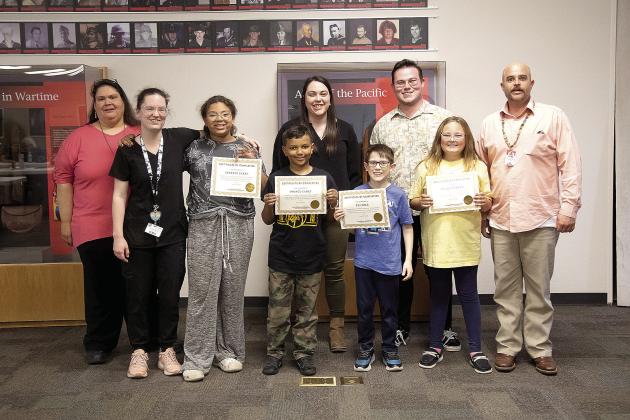 Teachers from CPN’s Child Development Center and after-school program and OSU’s University College of Education and Human Science’s Mixed Reality Laboratory present students certifications for completing a digital technology program. Photo provided by CPN